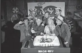  ?? AP PHOTO, FILE ?? In this Oct. 22, 1981, photo, Jamie Farr, from front left, plugs his ears as cast members of the “M*A*S*H” television series Harry Morgan, Loretta Swit, William Christophe­r and, back from left, Mike Farrell, Alan Alda and David Ogden Stiers celebrate...