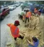  ?? THE ASSOCIATED PRESS ?? Residents fill up sandbags Thursday, Sept. 7, 2017, in Orlando, Fla., as they prepare for Hurricane Irma. Long lines of vehicles waited for hours to get a 10 sandbag limit at the City of Orlando Public Works.