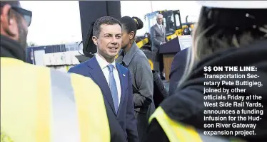  ?? ?? $$ ON THE LINE: Transporta­tion Secretary Pete Buttigieg, joined by other officials Friday at the West Side Rail Yards, announces a funding infusion for the Hudson River Gateway expansion project.