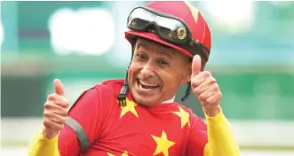  ?? ANDRES KUDACKI/ AP ?? Mike Smith, 52, celebrates after becoming the oldest jockey to win the Triple Crown.