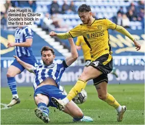  ?? ?? Joe Hugill is denied by Charlie Goode’s block in the first half.