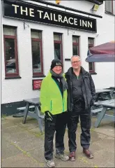  ?? ?? Murdo Morrison, left, and Andrew McHale set off from the Tailrace Inn, Kinlochlev­en.
Right: Double amputee Paul Ellis, sitting in front of the cairn, has raised more than £30,000 by crawling up Snowdon and Ben Nevis.