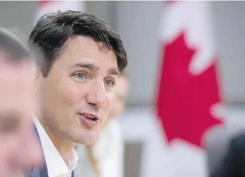  ?? JACQUES BOISSINOT / THE CANADIAN PRESS ?? Prime Minister Justin Trudeau said Friday he’s glad the U.S. has decided not to implement a border adjustment tax on Canadian goods.