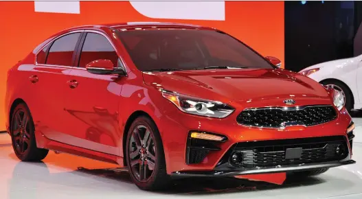  ?? PHOTOS: DEREK MCNAUGHTON ?? The latest Kia Forte is larger than its predecesso­r and has more passenger and cargo space. It has 2.0-L engine with 147 hp and pricing starts at $16,495.