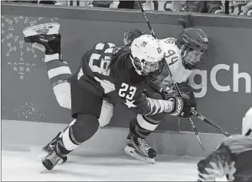  ?? FRANK FRANKLIN II/AP PHOTO ?? Sidney Morin of the United States (23) checks Russian athlete Yevgenia Dyupina (94) during the first period of Tuesday’s women’s hockey game at the Winter Olympics in Gangneung, South Korea. For more informatio­n please to go the AP Olympics page on...