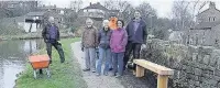  ??  ?? ●● Friends of Bollington Towpath with the new bench they recently installed