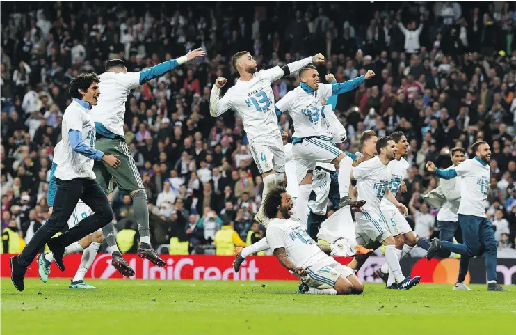  ?? — GETTY IMAGES ?? Real Madrid’s players celebrate after the UEFA Champions League semifinal second-leg match against FC Bayern Munich in Madrid on Tuesday.