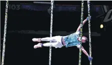  ??  ?? At left: A performer practices Wednesday for the Cirque du Soleil show at Chesapeake Energy Arena in Oklahoma City.