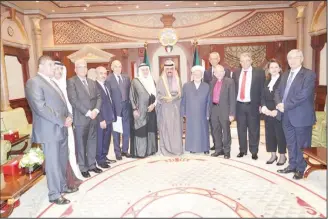  ??  ?? HH the Crown Prince receiving the Deputy Minister of Amiri Diwan Affairs Sheikh Mohammed Al-Abdullah and Chairman of Board of Trustees of Al-Quds Waqf Fund Prince Turki Al-Faisal bin Abdulaziz and board members.