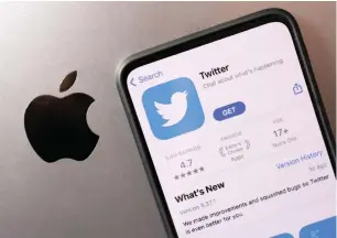  ?? ?? Smartphone with displayed Twitter app is seen placed on Apple logo in this illustrati­on taken, on Monday. — reuters