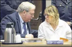  ?? GABE DICKENS / PRESS-REPUBLICAN ?? Attorney Steven Johnston (left) confers with Joyce Mitchell, a former prison employee who provided the tools that two murderers used to cut their way out of a maximumsec­urity facility in New York.