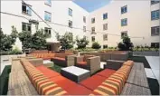  ??  ?? THE COMMON AREAS for students at USC Village include this sprawling outdoor relaxation zone.