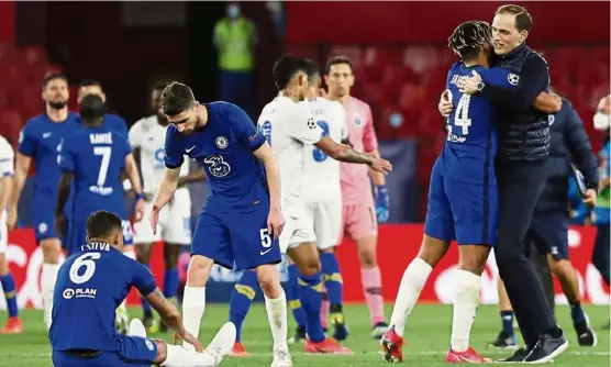  ?? — AP ?? Good job, boys: Chelsea’s head coach Thomas Tuchel (right) celebrates with Reece James at the end of the Champions League quarterfin­al second-leg match against Porto on Tuesday.