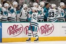  ?? Tony Gutierrez/Associated Press ?? Sharks left wing Alexander Barabanov (94) celebrates with the bench after scoring against Dallas in the first period Friday.