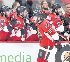  ?? USA TODAY SPORTS ?? Senators forward Mike Hoffman, No.68, celebrates with teammates after scoring the winning goal against the Penguins.
