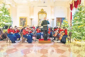  ?? ?? The Marine Band plays holiday favourites in Cross Hall.