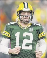  ?? Stacy Revere / Getty Images ?? Packers quarterbac­k Aaron Rodgers won the only previous meeting against Tom Brady in 2014, a five-point victory.
