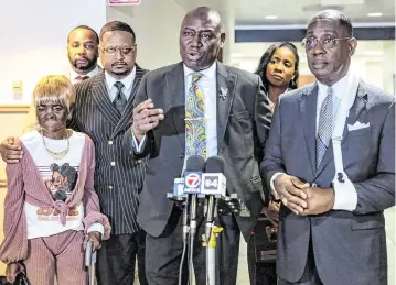  ?? D.A. VARELA dvarela@miamiheral­d.com ?? Ben Crump speaks alongside Denise Armstrong, left, the mother of Daniel Armstrong; attorney Sue Ann Robinson, back right; co-counsel Larry Handfield, front right; Pastor Gaston Smith, back left; and attorney B’Ivory LaMarr on Tuesday.