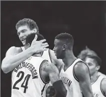  ?? Robert Sabo ?? COME HERE YOU: Brook Lopez hugs Rondae HollisJeff­erson, who scored 19 points on Saturday.