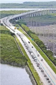  ?? THE ASSOCIATED PRESS ?? Motorists head north on U.S. 1 on Wednesday in Key Largo, Fla., in anticipati­on of Hurricane Irma.