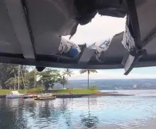  ?? SOURCE: HAWAII DEPARTMENT OF LAND AND NATURAL RESOURCES ?? An explosion sent lava flying through the roof of this tour boat off the Big Island of Hawaii on Monday. The lava came from the Kilauea volcano, which has been erupting in a residentia­l area since early May.