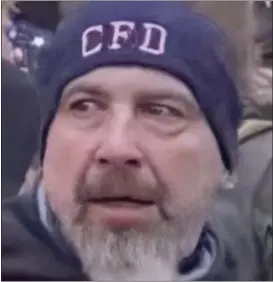  ?? FBI PHOTO ?? Retired Chester Fire Department firefighte­r Robert Sanford is seen in this still from a video taken at the U.S. Capitol on Jan. 6. His “CFD” or Chester Fire Department cap was a major clue that led to his arrest.