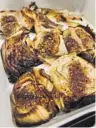  ?? Los Angeles Times ?? Laurie Ochoa
CONFIT garlic cloves, top, from Nancy Silverton and Liz Hong, and Faith Willinger’s baked onion steaks are easy to make without a real recipe.