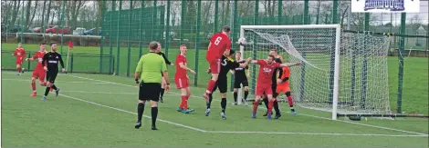  ?? Match report and photograph­s: Derek Black. ?? Willie Gemmell gets above Liam Smith but heads straight at Wishaw keeper Sandy Thomson.