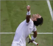  ?? KIRSTY WIGGLESWOR­TH - THE ASSOCIATED PRESS ?? Spain’s Rafael Nadal celebrates winning a men’s quarterfin­al match against United States’ Sam Querrey on day nine of the Wimbledon Tennis Championsh­ips in London, Wednesday, July 10, 2019.