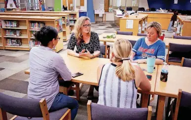  ?? [PHOTO BY DOUG HOKE, THE OKLAHOMAN] ?? Sarah Carnes, a Mustang art teacher, who is running for public office, meets with a teacher advocacy group recently at Prairie View Elementary school.