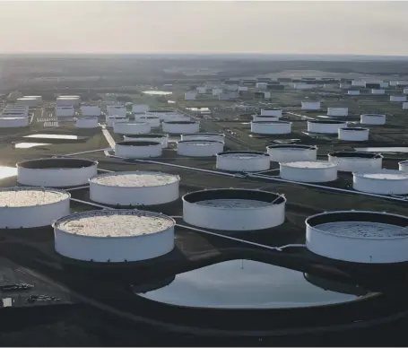  ?? Bloomberg ?? Storage tanks in Cushing, Oklahoma. The US stepped in to help the oil industry after WTI prices fell below minus $40