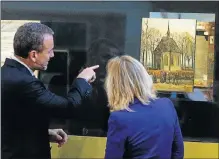  ?? Picture: REUTERS ?? SAFELY HOME: Van Gogh Museum director Axel Rueger and Dutch Education, Culture and Science Minister Jet Bussemaker reveal two recovered Van Gogh paintings, which were stolen in 2002