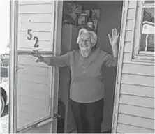  ?? CONTRIBUTE­D ?? Joyce Peach of Port Morien waves at son Stan Peach of Glace Bay during one of the drive by checks he does each week.