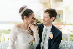  ?? Associated Press ?? ■ Caitlin Koska, left, and Michael White appear with their 14-year-old rescue dog, Luna, at their wedding on May 1, 2021, in St. Joseph, Mich. The couple adopted their pet after her owner died. They used Tyson’s Place Animal Rescue, a specialize­d organizati­on focused on helping the terminally ill and seniors headed to residentia­l care.