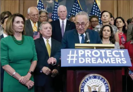  ?? AP PHOTO — JOSE LUIS MAGANA ?? In this file photo, Senate Minority Leader Chuck Schumer of N.Y., accompanie­d by House Minority Leader Nancy Pelosi of Calif., left, and others members of the House and Senate Democrats, speaks during a news conference on Capitol Hill in Washington.