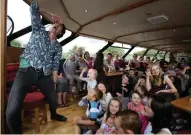  ??  ?? Storytelle­r Niall de Burca entertains children during the Wild Words Children’s Book Festival in Carrick-onShannon.