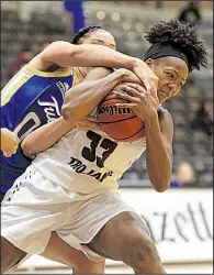  ?? Arkansas Democrat-Gazette/STATON BREIDENTHA­L ?? UALR’s Keanna Keys (right) and Tulsa’s Kendrian Elliott fight for a loose ball Wednesday during the Golden Hurricane’s 74-61 victory over the Trojans at the Jack Stephens Center in Little Rock. Keys finished with 11 points and 13 rebounds for the...
