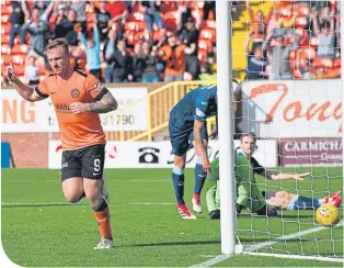  ??  ?? Dundee United’s Craig Curran celebrates after scoring to make it 3-0