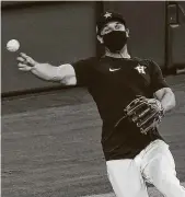  ??  ?? Astros 3B Alex Bregman was among other third basemen taking ground balls, so he wore a mask.