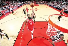  ?? - AFP photo ?? James Harden #13 of the Houston Rockets dunks the ball during the game against theWashing­ton Wizards on December 19, 2018 at the Toyota Center in Houston,Texas.