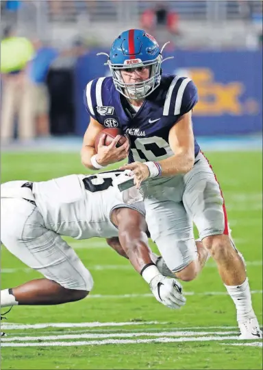  ?? [ROGELIO V. SOLIS/THE ASSOCIATED PRESS] ?? Mississipp­i quarterbac­k John Rhys Plumlee rushed for 165 yards to lead a 413-yard rushing attack last week in a 31-6 rout of Vanderbilt.