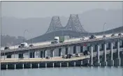  ?? ALAN DEP — MARIN INDEPENDEN­T JOURNAL, FILE ?? Traffic flows across the Richmond-San Rafael Bridge. The bridge and the other six state-owned Bay Area spans will not bring back toll takers, who were removed for coronaviru­s safety.