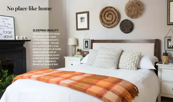  ??  ?? SLEEPING BEAUTY Interestin­g textures boost the warmth and depth of the master bedroom’s tranquil scheme. Chunkyknit cushions add a cosy element and a trio of tactile woven baskets add an unusual decorative touch to the wall. Karla painted the walls in Elephant’s Breath by Farrow &amp; Ball.