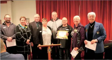  ??  ?? New members and sponsors pose as follows. From left: Sponsor John Forbes, Lee Schoeman, president Mike Harold, zone chairwoman Vicki Wolland (centre), new Lion Larry Schoeman (tall), new Lion Larry Evans, sponsors Yvonne Popow, Barbara Ferguson.