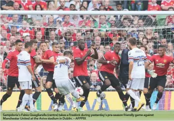  ??  ?? Sampdoria’s Fabio Quagliarel­la (centre) takes a freekick during yesterday’s pre-season friendly game against Manchester United at the Aviva stadium in Dublin. – AFPPIX