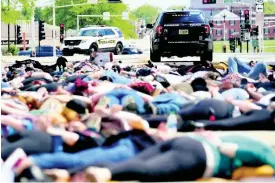  ??  ?? Protesters lie on the ground during a Black Lives Matter rally in Oshkosh, Wisconsin, yesterday.