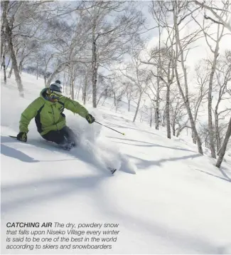  ??  ?? CATCHING AIR The dry, powdery snow that falls upon Niseko Village every winter is said to be one of the best in the world according to skiers and snowboarde­rs