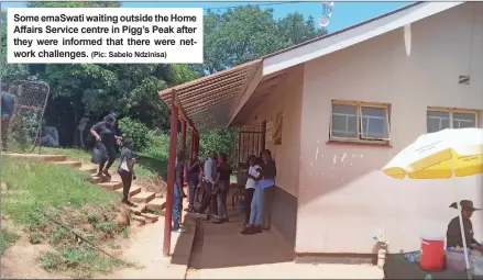  ?? (Pic: Sabelo Ndzinisa) ?? Some emaSwati waiting outside the Home Affairs Service centre in Pigg’s Peak after they were informed that there were network challenges.