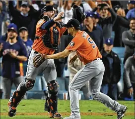  ?? ASSOCIATED PRESS ?? Charlie Morton, with fellow ex- Brave Brian Mccann after clinching the Astros’ 2017 World Series title, also has pitched for the Pirates, Phillies and Rays.