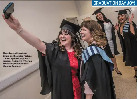  ??  ?? Fiona Treacy Bowe from Dublin and Georgina Fortune from Greystones capture a moment during the IT Carlow conferring ceremonies at Wicklow Campus.